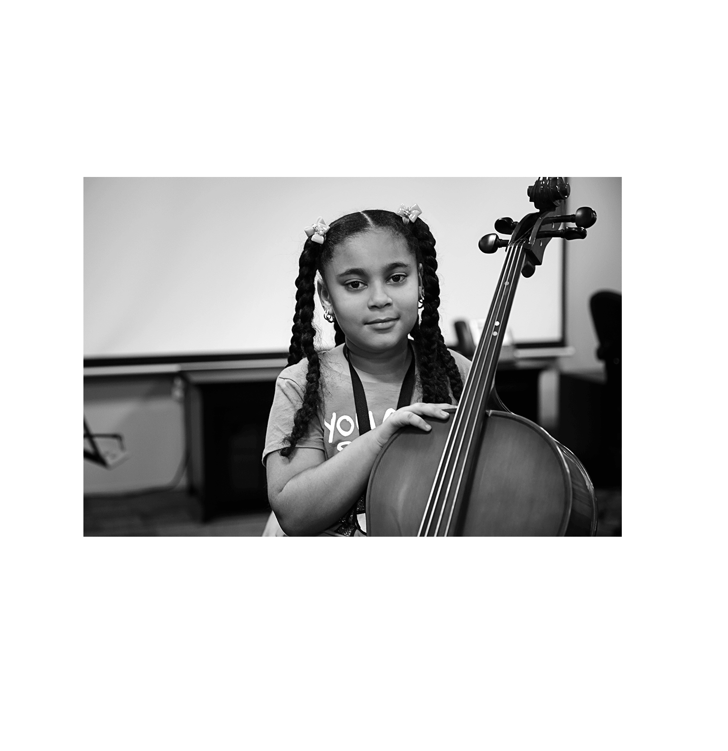 girl holding a cello